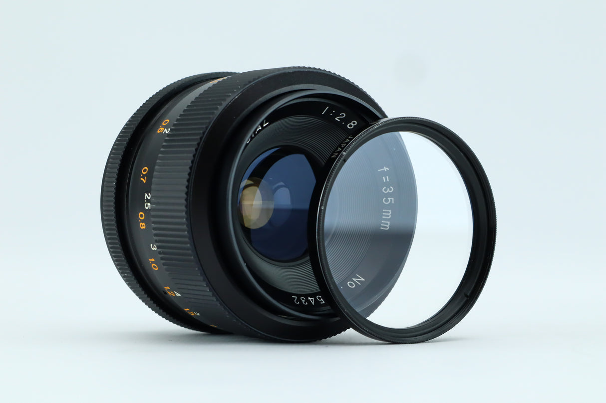 Revuenon-Spezialobjektiv 1:2,8 f=35 mm