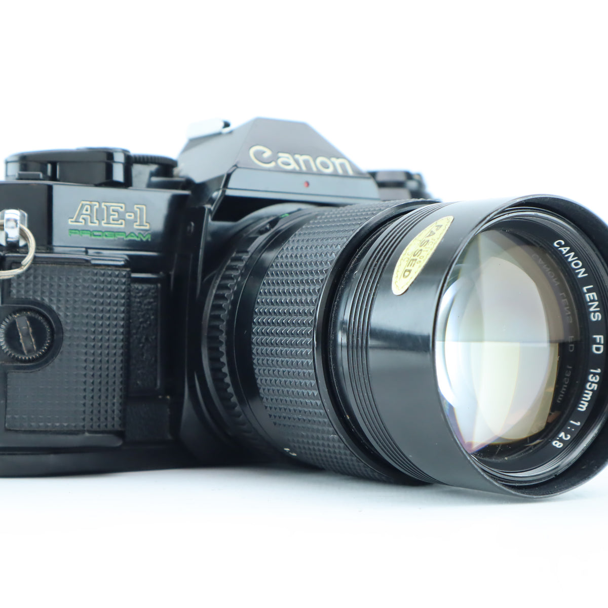 Canon AE-1 Program with Canon lens FD 135mm 1:2,8 - Zie tekst 