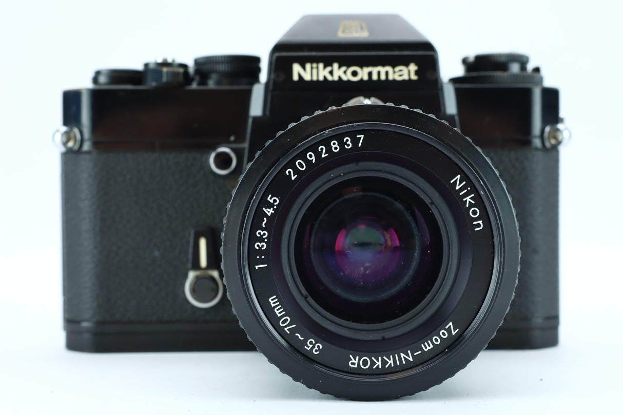 Nikkormat (SN: w7516249) + Nikon Zoom 35–70mm f/3.3–4.5 (SN: 2092837) – Solid Mechanical SLR with Versatile Zoom Lens