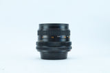 RMC Tokina 28mm f/2.8 with Wide-Angle Hood | S/N: 7704163